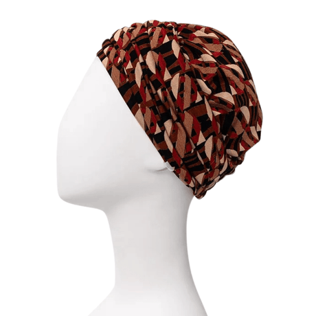 Sapphire Boho Turban mit Tribal Art Muster, von links auf einer weißen Schaufensterpuppe